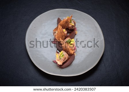 roasted pork with stewed beetroot  Royalty-Free Stock Photo #2420383507