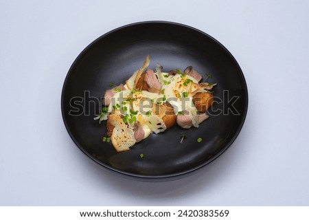 baked pork meat bowl with melted cheese Royalty-Free Stock Photo #2420383569