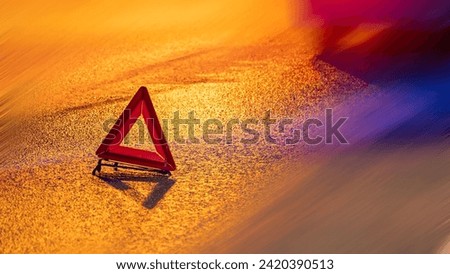 emergency stop sign at night, blurred background in motion, road accident accident on night highway, red triangle sign. car breakdown, car stopping on the edge of the road at night.