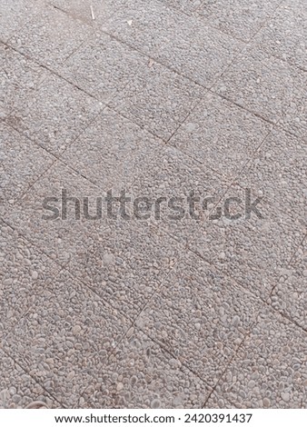 Grey brick wall background. Paver brick floor also called brick paving, paving stone, or block paving, texture background