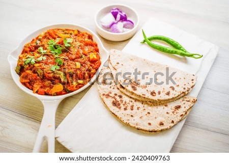Indian food Curry sevtamatar, cabbage, Chiken Tikka, Biryani, Vegetable Curry, Papad, Dal, Palak Sabji, Jira Alu, Rice Royalty-Free Stock Photo #2420409763