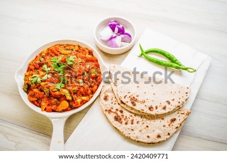 Indian food Curry sevtamatar, cabbage, Chiken Tikka, Biryani, Vegetable Curry, Papad, Dal, Palak Sabji, Jira Alu, Rice Royalty-Free Stock Photo #2420409771