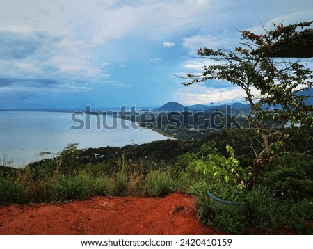 Beautiful scenery for top of hill with tree and with ocean, beach, mountain, blue skies in afternoon, mount with ground, nature in south east asia