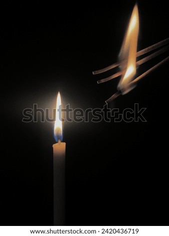 The fire of 3 incense sticks and 1candle is often used when someone wants to make a wish from something they believe in Royalty-Free Stock Photo #2420436719