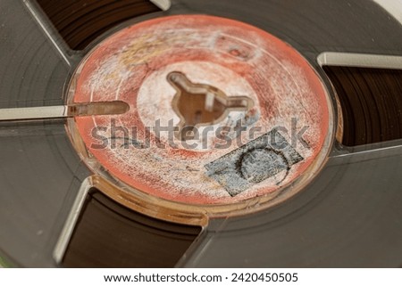 Vintage reel tape recorder close view Royalty-Free Stock Photo #2420450505