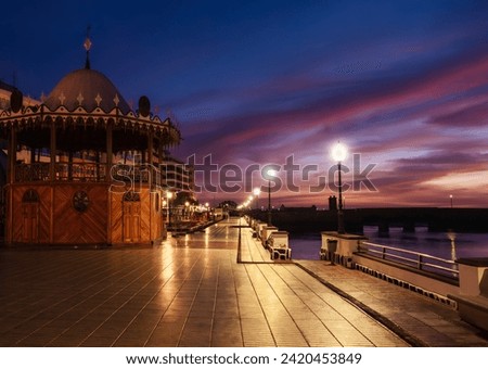 Promenade illuminated with romantic lamps on the ocean coast in the capital of Lanzarote Arrecife in the morning at sunrise, in the Canary Islands - Spain Royalty-Free Stock Photo #2420453849