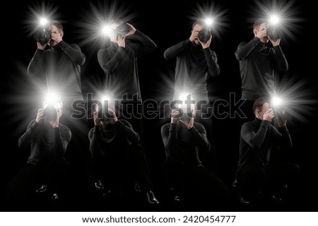 Group of photographers with cameras on black background. Paparazzi taking pictures with flashes