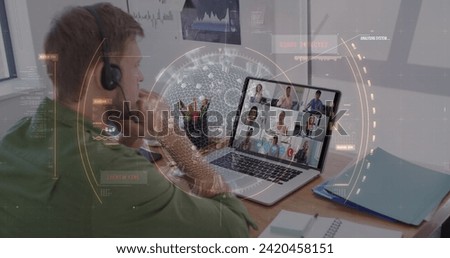 Image of scope scanning with covid 19 cell over man using laptop on image call. Digital interface global covid 19 pandemic, connection and communication concept digitally generated image.