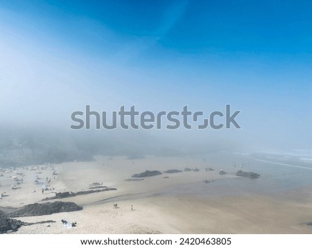 Fog at the ocean beach, ocean bay, rocky coast, sandy beach