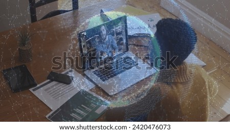 Image of globe of connections over woman using laptop on image call in background. Digital interface global connection and communication concept digitally generated image.