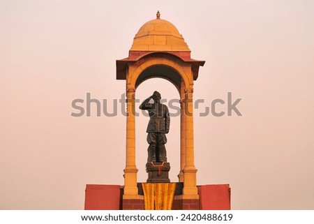 Statue of Subhas Chandra Bose under canopy behind India Gate war memorial, monolithic Netaji statue made of black granite in New Delhi immortalizes Indian freedom fighter of Indian National Army Royalty-Free Stock Photo #2420488619