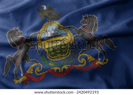 waving colorful national flag of pennsylvania state. macro shot