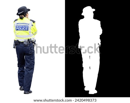 Rear view of an anonymous London Metropolitan Policewoman isolated on white background with space for text and with clipping mask and path