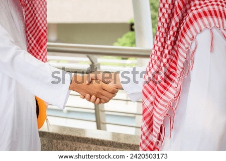 Arab Middle Eastern Businessman handshake, Business meeting with arab man and shaking hands in greetings
