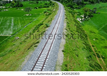 View of railway tracks in rural Indonesia in the afternoon