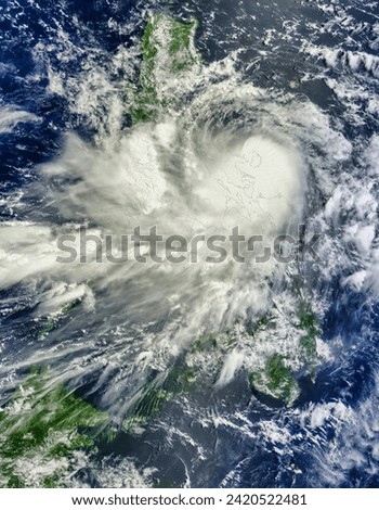 Tropical Storm Nockten 10W over the Philippines. Tropical Storm Nockten 10W over the Philippines. Elements of this image furnished by NASA. Royalty-Free Stock Photo #2420522481