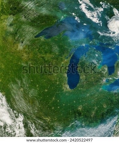 Haze over the Great Lakes. . Elements of this image furnished by NASA. Royalty-Free Stock Photo #2420522497