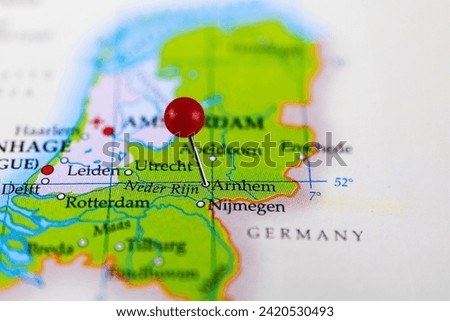 Arnhem, Netherlands. Close-up of Arnhem map with red pin on the map of Netherlands.