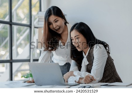 Joyful businesswoman freelancer entrepreneur smiling and rejoices in victory while sitting at desk after working finishing project, Excited happy woman, overjoyed motivated.