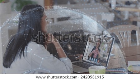 Image of globe with network of connections over woman using laptop on image call in background. Digital interface global connection and communication concept digitally generated image.