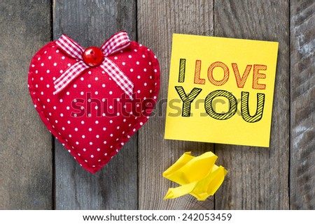 Card with I love you. Card with I love you and heart on wooden background