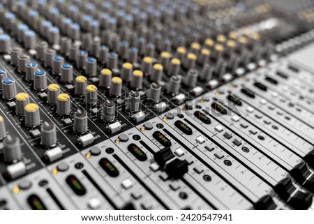 Mixer control. Music engineer. Backstage controls on an audio mixer, Sound mixer. Professional audio mixing console with lights, buttons, faders and sliders. sound check for concert. Royalty-Free Stock Photo #2420547941