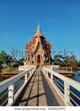 Church in the middle of the water.Thai temple.The sky is clear. Royalty-Free Stock Photo #2420552991
