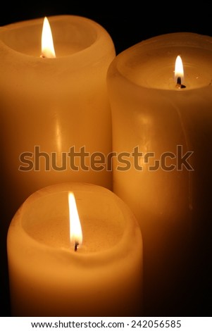 Candle and candlelight in the dark