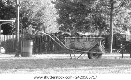 Black and white picture of wheelbarrow 