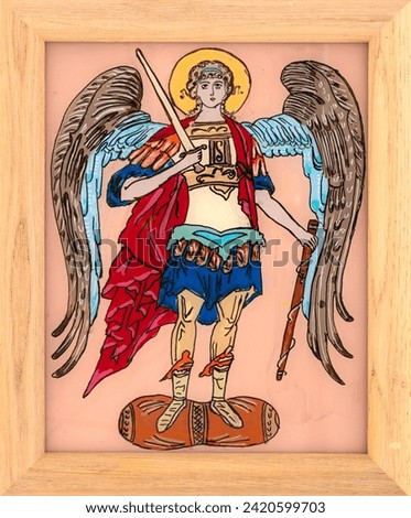 Icon painted on reverse glass in the naive orthodox style of Eastern Europe depicting Archangel Michael. Framed icon. Royalty-Free Stock Photo #2420599703