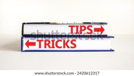 Tips and tricks symbol. Concept word Tips and tricks on beautiful books. Beautiful white table white background. Business and Tips and tricks concept. Copy space.