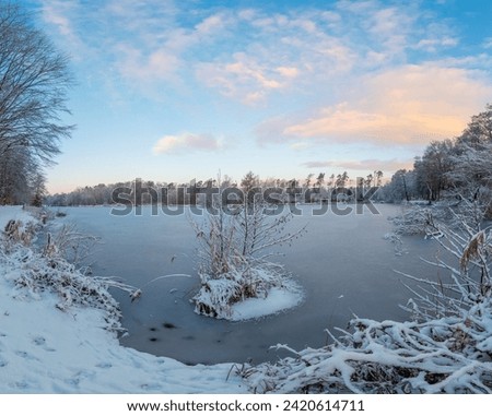 Picture of a frozen pond in the morning light at sunrise
