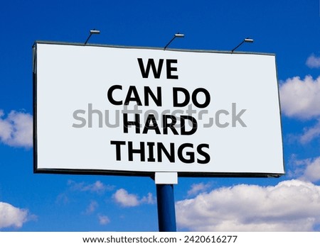We can do hard things symbol. Concept words We can do hard things on beautiful billboard. Beautiful blue sky clouds background. Business, we can do hard things concept. Copy space.