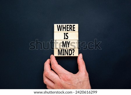 Where is my mind symbol. Concept words Where is my mind on wooden block. Beautiful black table black background. Businessman hand. Business, motivational and where is my mind concept. Copy space.