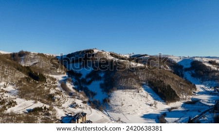 Aerial view of Brzece Ski Resort in Kopaonik National Park, Serbia, Europe. Aerial View of the Ski Town of Europe. Winter landscape from a drone. Snowy landscape on ski resort. Aerial photography