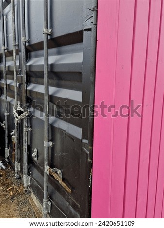 The black shipping container serves as a folded material. if refrigeration is supplied, it is a coffin warehouse with the dead in an uncontrollable epidemic crisis Royalty-Free Stock Photo #2420651109