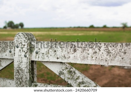Rusty wooden gate at the entrance to a farm in Entre Rios, Argentina