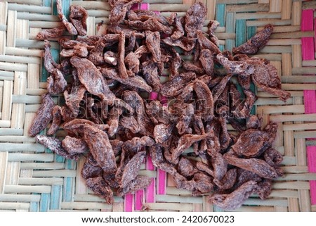 Asam sunti is a kitchen spice from Aceh which is made from starfruit which is dried and salted, then dried in the hot sun many times so that it is dry and can be stored for a long time. Royalty-Free Stock Photo #2420670023