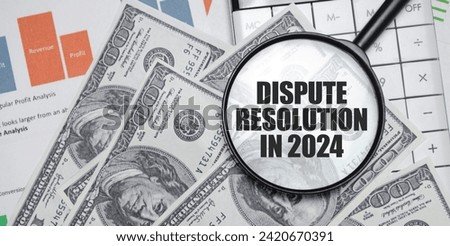 DISPUTE RESOLUTION IN 2024 word on magnifying glass with dollars and charts Royalty-Free Stock Photo #2420670391