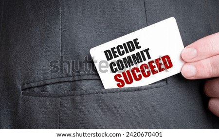 Card with DECIDE COMMIT SUCCEED text in pocket of businessman suit. Investment and decisions business concept.