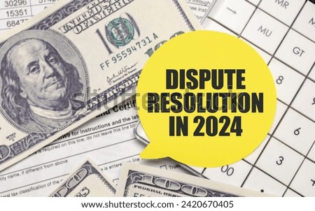 DISPUTE RESOLUTION IN 2024 on yellow sticker with pen and calculator Royalty-Free Stock Photo #2420670405