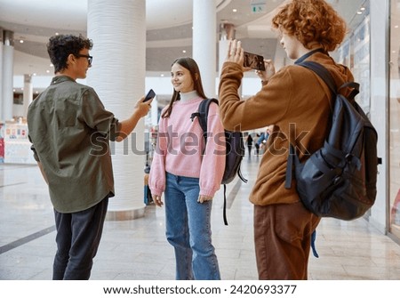 Teenager friends recording interview streaming live video from shopping mall Royalty-Free Stock Photo #2420693377