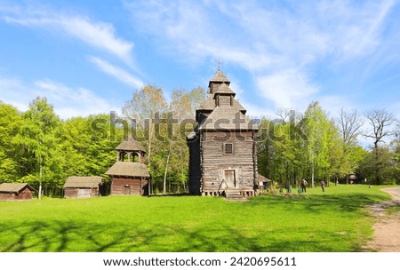 Old wooden church in Pirogovo (Church of the Resurrection from Poltava) in Kyiv, Ukraine Royalty-Free Stock Photo #2420695611