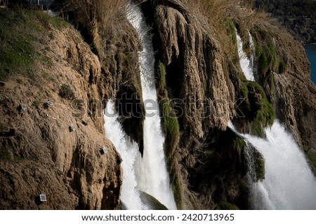 Duden Waterfall (Karpuzkaldiran selalesi) falling into the Mediterranean sea. Waterfall falling into sea.