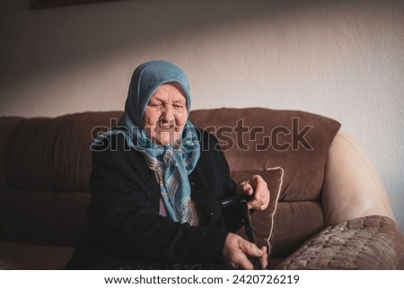 Beautiful face portrait of a happy Muslim grandmother in hijab. . High quality photo