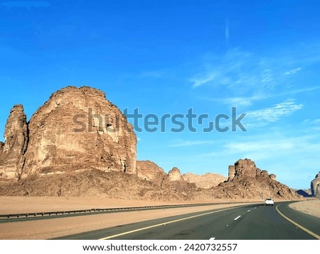 Road between stone mountains in the city of Tabuk in Saudi Arabia.