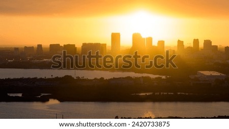 View from above of contemporary high skyscraper buildings in downtown district of Tampa city in Florida, USA at sunset. American megapolis with business financial district