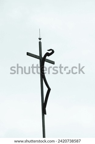 Decoration of a crucifix made of iron on a street in Barcelona.