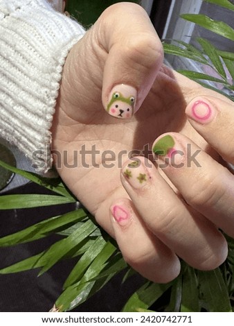Cute manicure. Cute manicure design . Manicure in pink and green colors