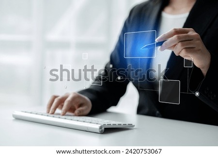 Person with hologram flowchart, businessman designing flowchart business workflow to systematically qualitatively, flowcharting to visualize the workflow of the program. Flowchart design concept. Royalty-Free Stock Photo #2420753067